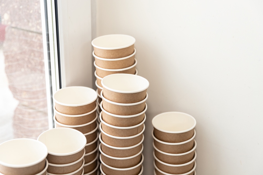 Two,Disposable,Paper,Cups,On,The,Windowsill.,Black,Color.,White